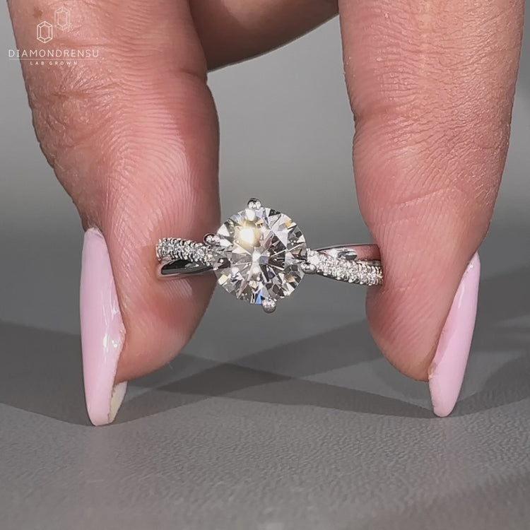 Twisted pave band adds brilliance to this custom engagement ring.
