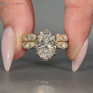 Marquise and round side stones with vintage style and milgrain details.
