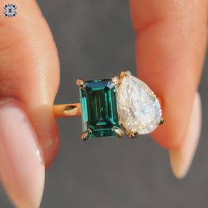 Pear and emerald cut ring in two-stone engagement style
