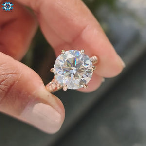 Moissanite solitaire ring with a sleek, elegant band.
