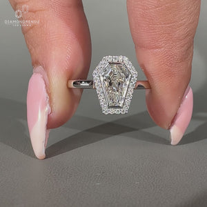 Lab grown coffin diamond ring with round halo design.