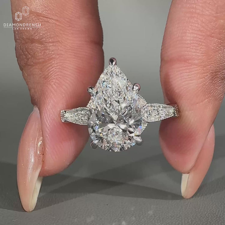 Pear Shaped Engagement Ring featuring a brilliant diamond center.
