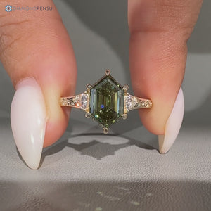 Hexagon shape diamond ring with trillion side stones.