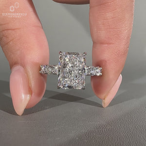Round cut pave band ring with hidden halo design.

