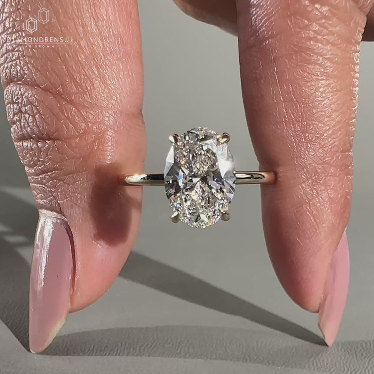 Oval Shaped Engagement Ring featuring a hidden halo design.