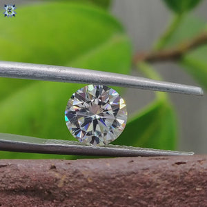 Round cut Moissanite featured as a loose Moissanite stone for custom solitaire earrings.