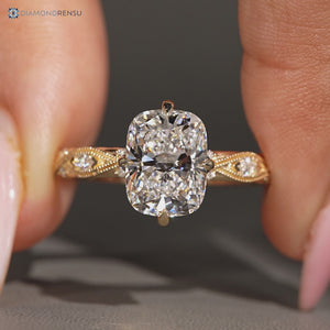 Cushion cut diamond ring with round and marquise stones.