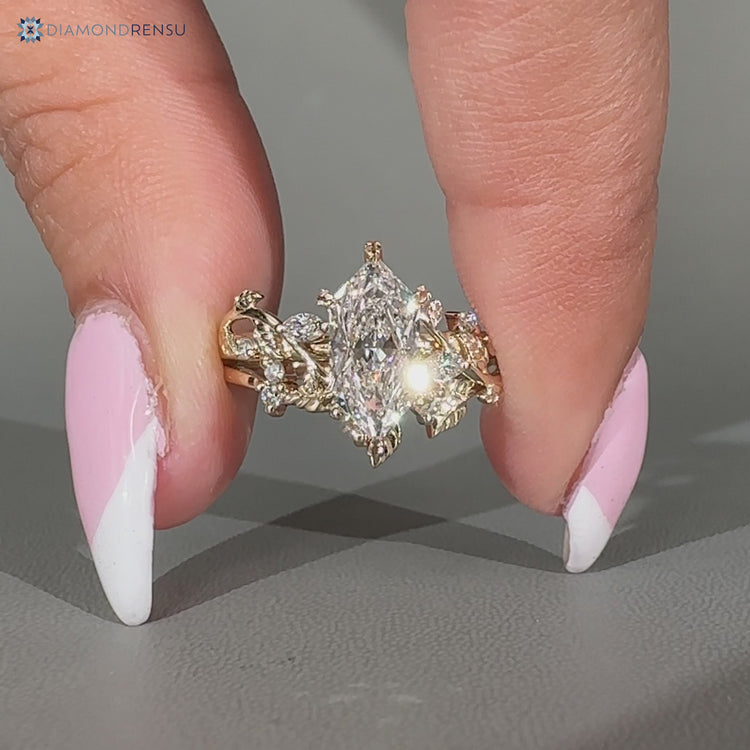 Nature inspired Dutch marquise ring with cluster setting.