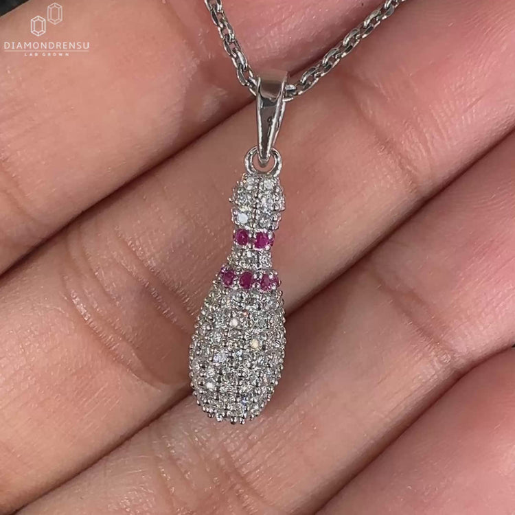 Diamond Bowling Pin charm pendant in gold with prong setting.
