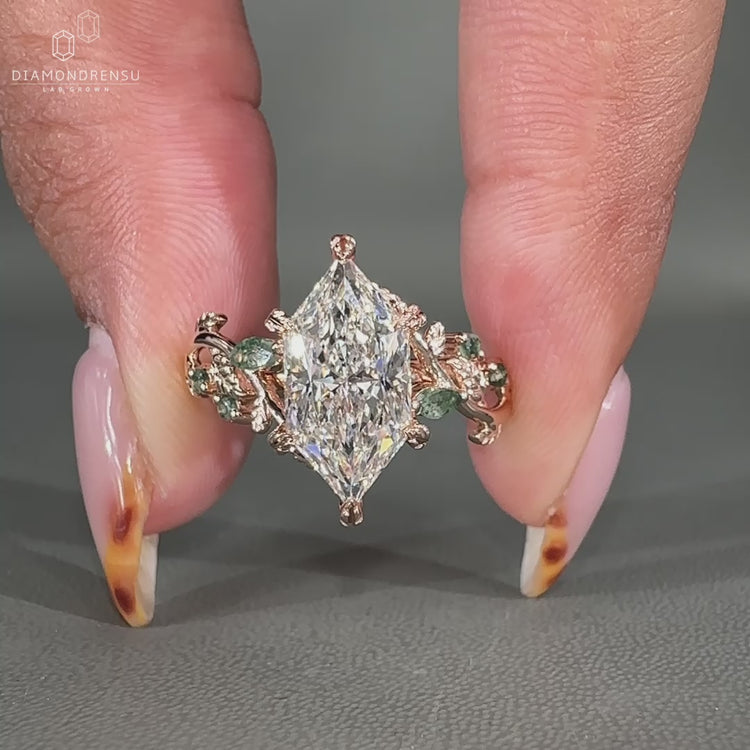 Dutch marquise cut engagement ring with round side stones.
