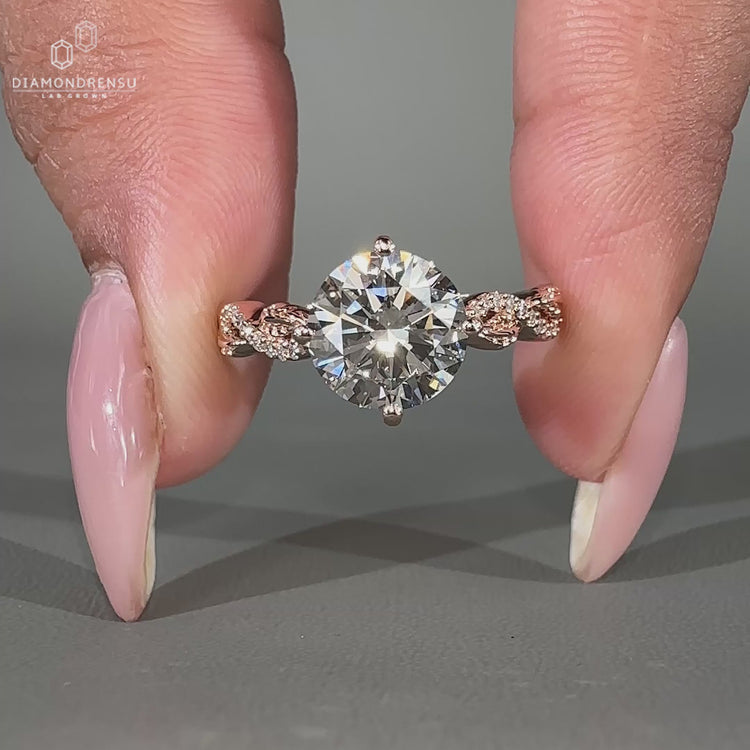 Rose gold engagement ring featuring a twisted pave ring style.
