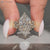 Dutch marquise engagement ring with a cluster setting.