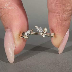 Lab grown wedding band with marquise stone and pave style round diamonds.