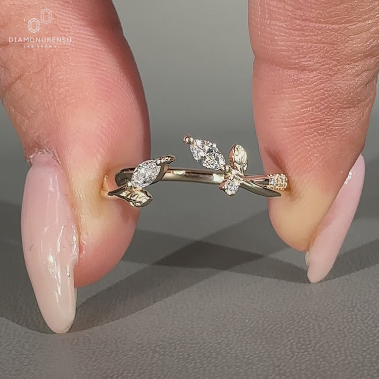 Lab grown wedding band with marquise stone and pave style round diamonds.