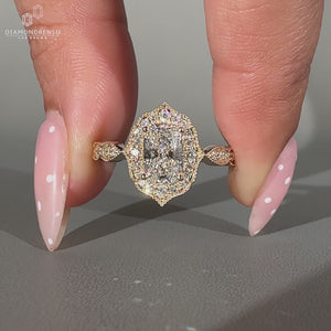 Elongated Cushion Diamond Ring With Round Cut Halo Setting.