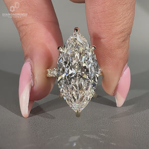 Marquise diamond ring with hidden halo.
