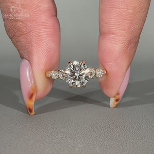 Round Cut Diamond Ring with prong setting and hidden halo.
