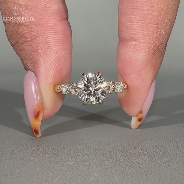 Round Cut Diamond Ring with prong setting and hidden halo.
