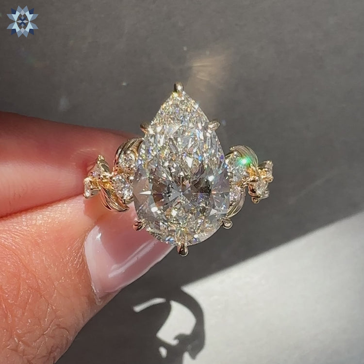 Nature inspired pear cut lab grown diamond engagement ring.
