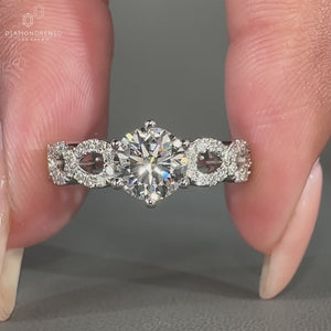 Twisted band engagement ring in white gold with a modern design.
