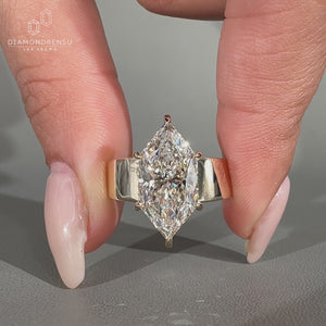 Tapered shank ring with marquise diamond design.

