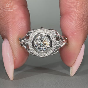 Unique nature inspired ring featuring a round cut diamond in a vintage milgrain setting.
