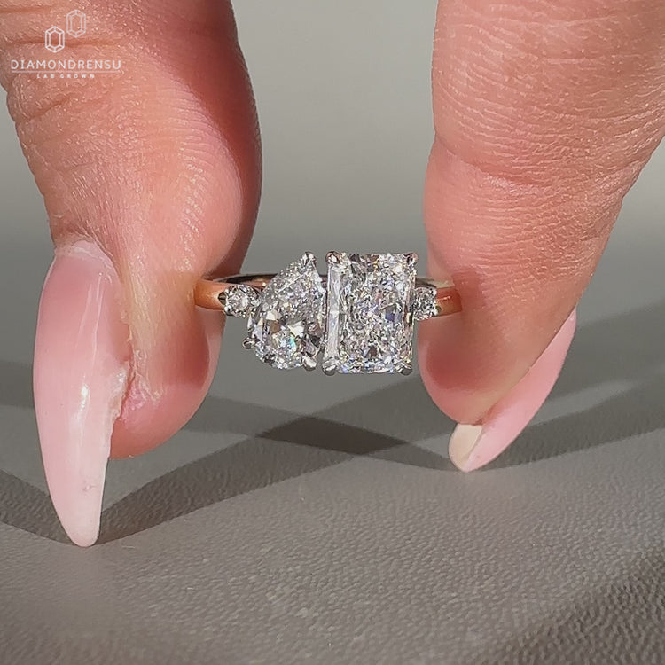 Handmade two stone ring with lab grown pear and radiant diamonds.
