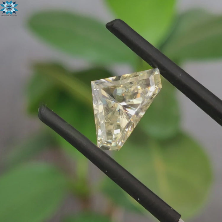 Loose moissanite stone showcasing off white moissanite hues.
