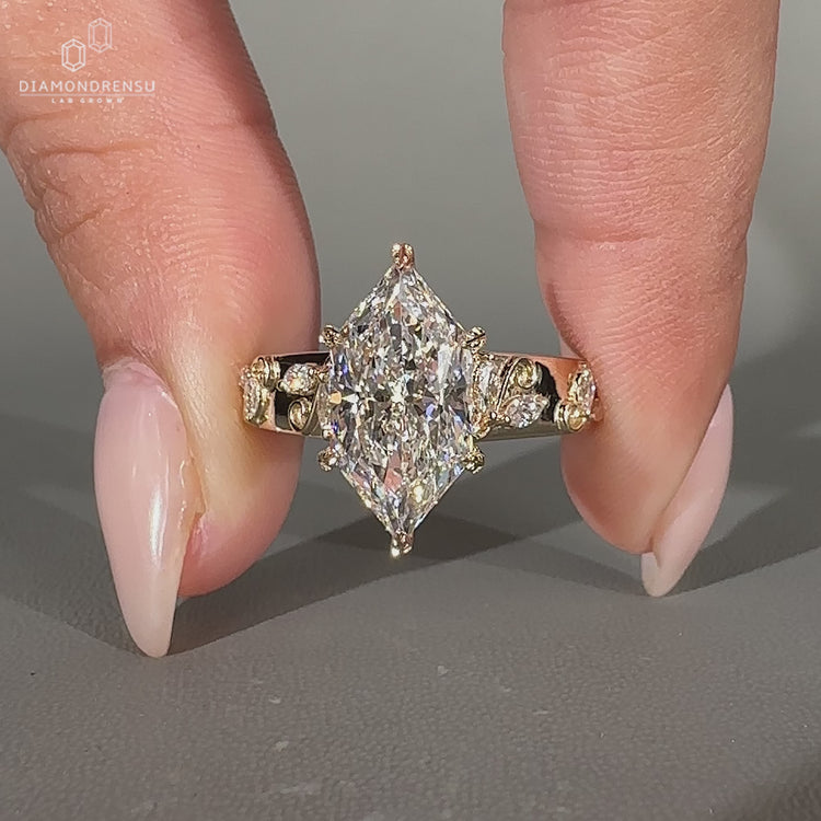 Art deco ring with a tapered shank and cathedral setting for a refined appearance.
