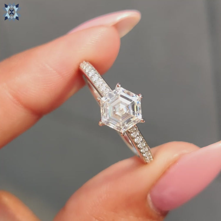 Hexagon engagement ring with a round cut engagement ring center for elegance.
