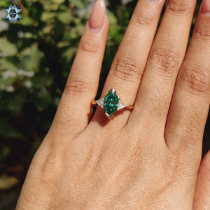 Elegant 3 stone ring featuring a brilliant moissanite center.
