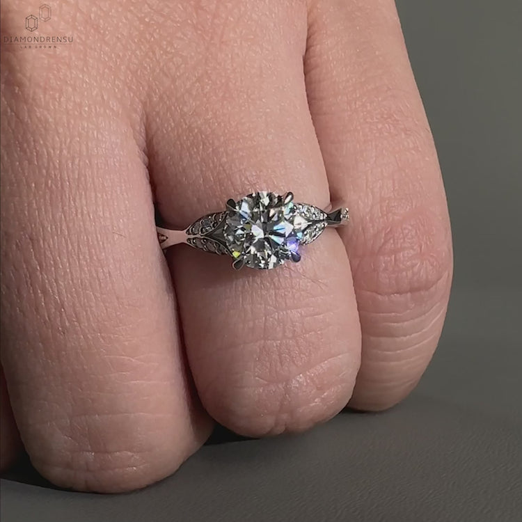 Elegant round cut diamond engagement rings with claw prongs and nature-inspired design