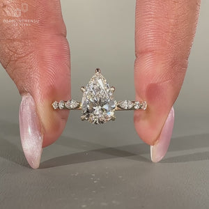 A marquise and round side stone mix brings extra shine.
