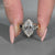 Marquise Old European cut ring with 2 v shaped prong design.
