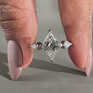 3 Stone Engagement Ring featuring a stunning lozenge cut diamond.