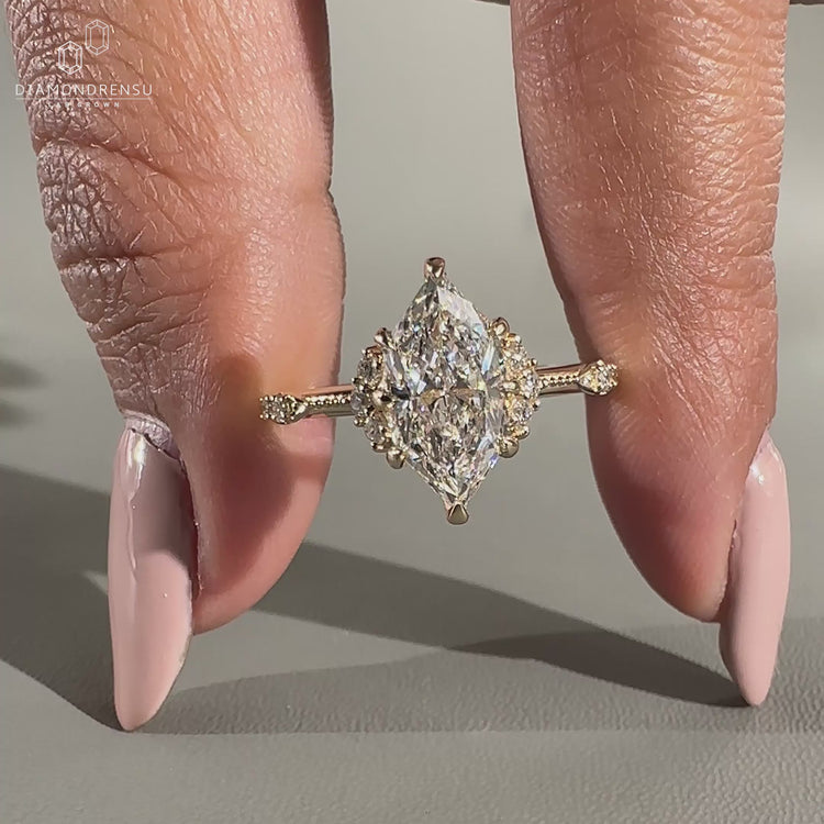 Vintage engagement ring with Dutch marquise diamond and milgrain setting.
