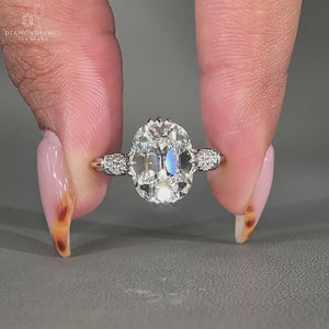Cushion old mine diamond ring with milgrain details and cathedral setting.
