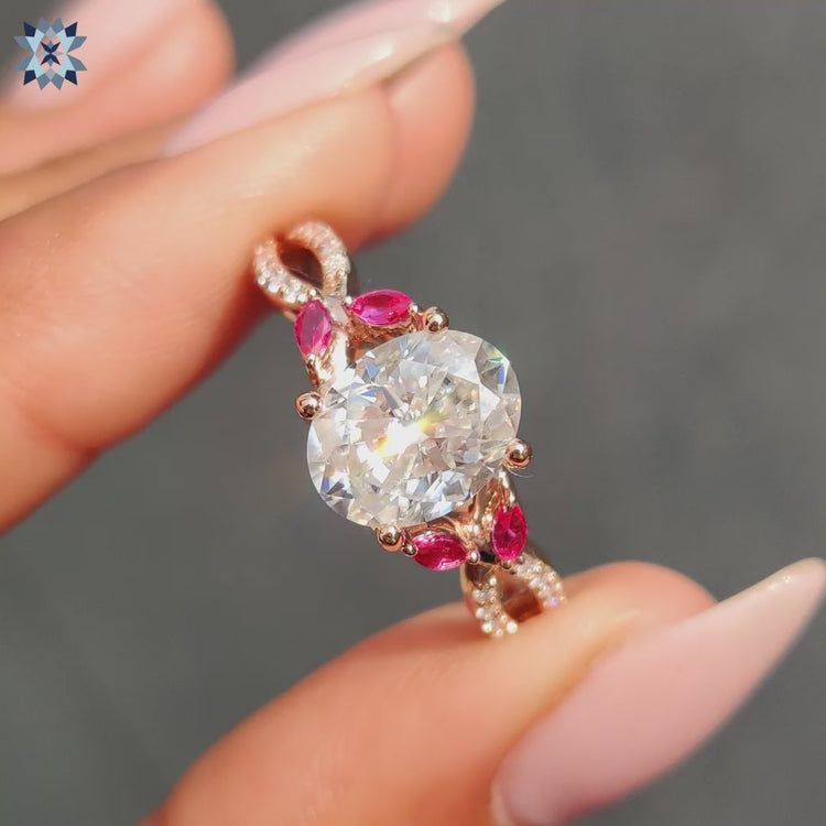 Muse ring with red marquise side stones.
