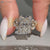 Nature inspired radiant ring with round diamond accents.