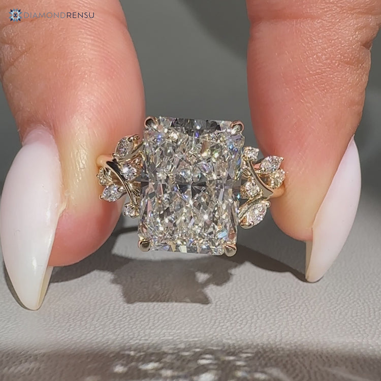 Nature inspired radiant ring with round diamond accents.