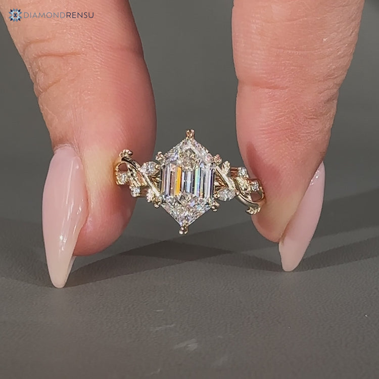 Lab grown hexagon diamond ring with marquise and round side stones.