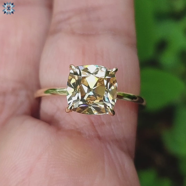 A radiant cushion cut ring with a handmade touch, designed for timeless beauty.