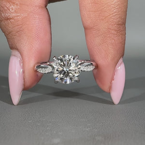 Elegant twist shank engagement ring displayed on a bridal magazine.
