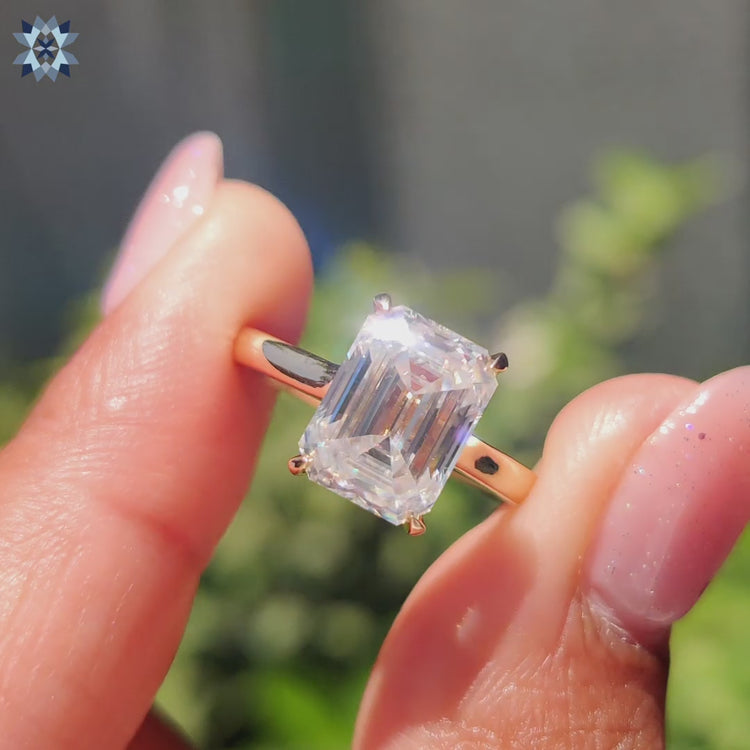 Emerald cut solitaire ring, offering timeless elegance with a beautifully cut moissanite stone.
