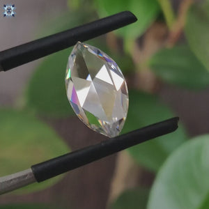 4.10 carat moissanite shining beside moissanite loose stone.
