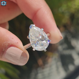 Solitaire engagement ring with a Pear Rensu cut center stone.
