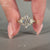 Round cut side stone ring in yellow gold with 6 claw prong setting.
