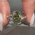 Nature inspired oval engagement ring in green.