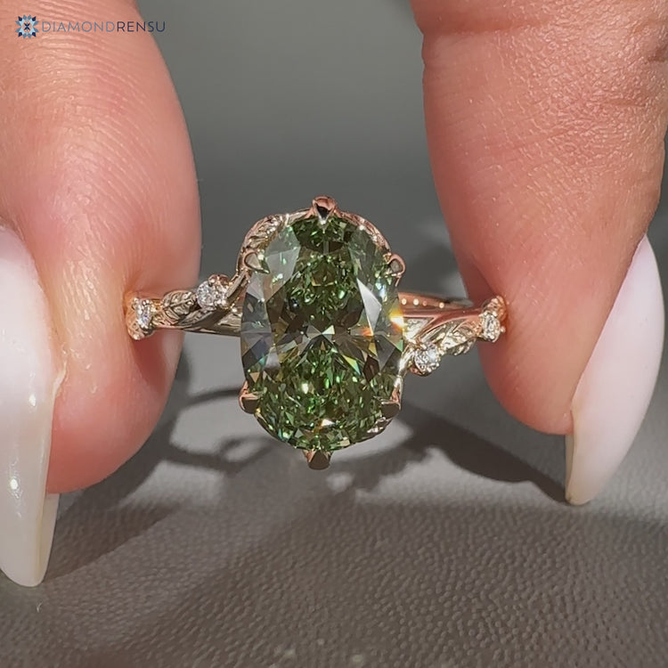 Nature inspired oval engagement ring in green.
