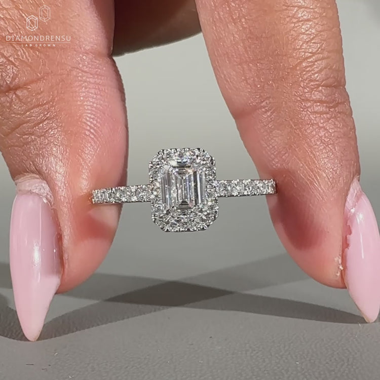 Emerald cut ring set in a beautiful white gold engagement ring for timeless elegance.
